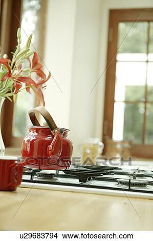Picture - Kettle on stove. Fotosearch
