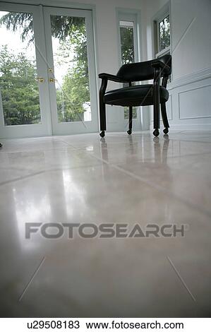 Stock Image - Room with one chair. Fotosearch