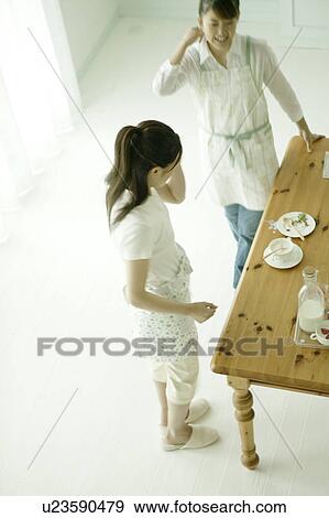 Stock Photo - Two young women talking. Fotosearch