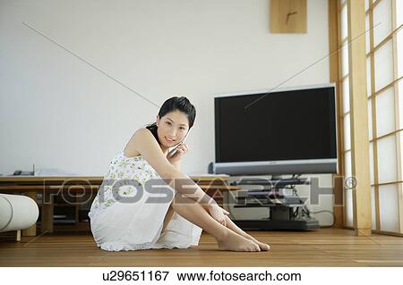 Young woman talking on mobile phone View Large Photo Image Stock Photo - Young woman talking on mobile phone. Fotosearch