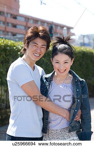 Picture - Young couple embracing. Fotosearch