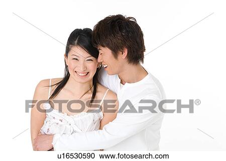 Stock Image - Young couple embracing. Fotosearch