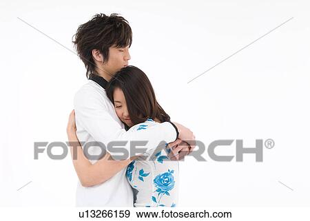 Young couple embracing View Large Photo Image Stock Photo - Young couple embracing. Fotosearch