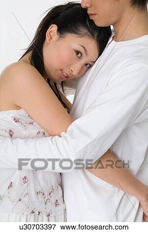 Young couple embracing View Large Photo Image Stock Photo - Young couple embracing. Fotosearch