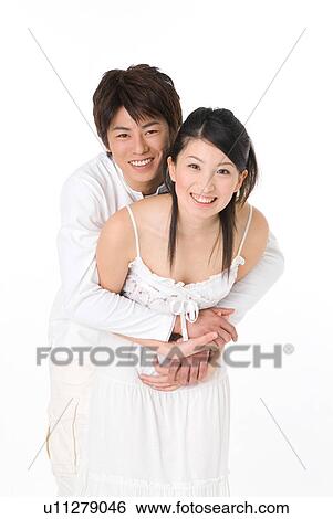 Young couple embracing View Large Photo Image Stock Photograph - Young couple embracing. Fotosearch