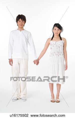 Young couple holding hands View Large Photo Image Stock Image - Young couple holding hands. Fotosearch