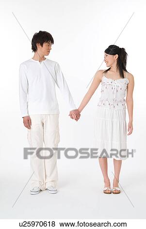 Young couple holding hands View Large Photo Image Stock Photo - Young couple holding hands. Fotosearch