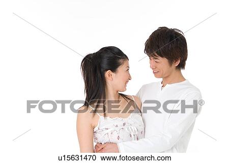 Young couple looking at each other View Large Photo Image Stock Image - Young couple looking at each other. Fotosearch