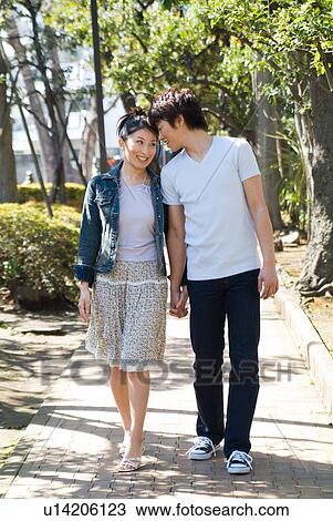 Stock Image - Young couple walking. Fotosearch