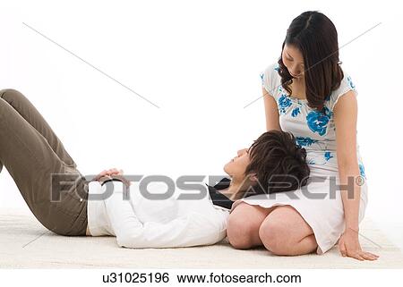 Young man sleeping with his head on woman's lap View Large Photo Image Stock Photograph - Young man sleeping with his head on woman's lap. Fotosearch