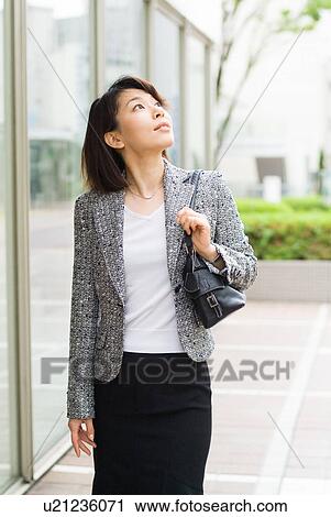 A mid adult woman looking up View Large Photo Image Stock Image - A mid adult woman looking up. Fotosearch