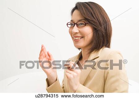 A mid adult woman talking with smile View Large Photo Image Stock Photography - A mid adult woman talking with smile. Fotosearch