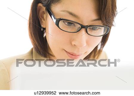 A mid adult woman working with computer View Large Photo Image Stock Image - A mid adult woman working with computer. Fotosearch