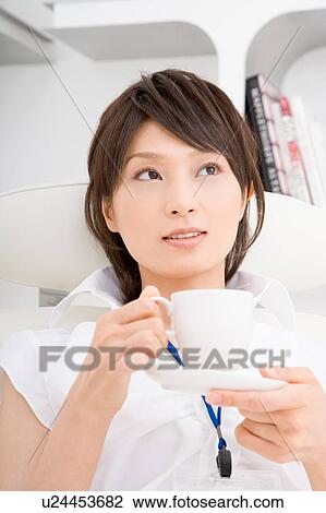 A young woman resting on sofa View Large Photo Image Stock Image - A young woman resting on sofa. Fotosearch