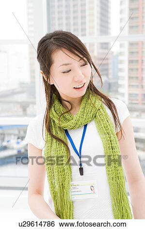 Stock Photograph - A young woman talking. Fotosearch