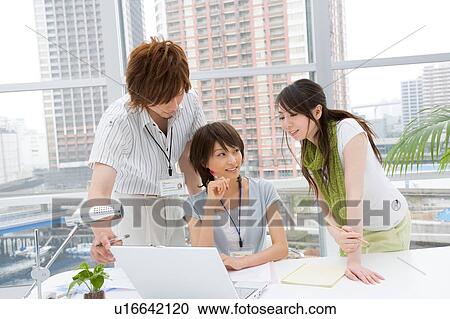 Three people discussing View Large Photo Image Stock Image - Three people discussing. Fotosearch