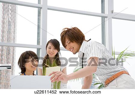 Three people discussing View Large Photo Image Stock Image - Three people discussing. Fotosearch