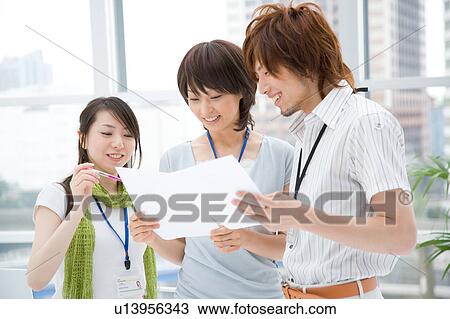 Three people talking View Large Photo Image Stock Image - Three people talking. Fotosearch