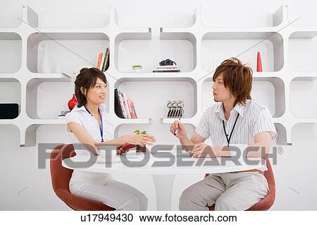 Two people discussing View Large Photo Image Stock Image - Two people discussing. Fotosearch