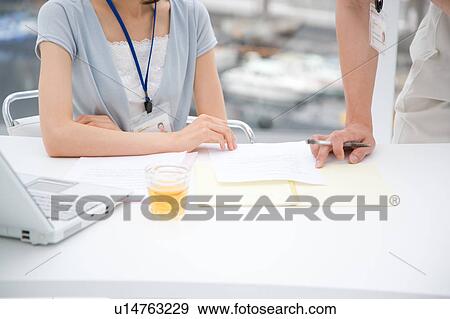 Two people discussing View Large Photo Image Stock Photo - Two people discussing. Fotosearch