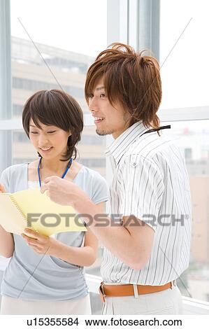 Young woman and man discussing View Large Photo Image Picture - Young woman and man discussing. Fotosearch