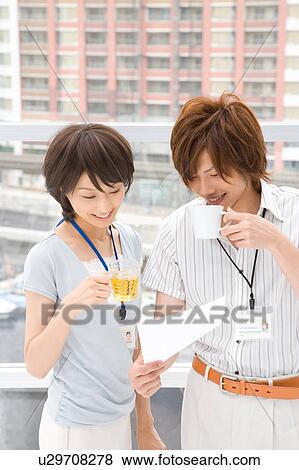 Stock Photo - Young woman and man discussing. Fotosearch