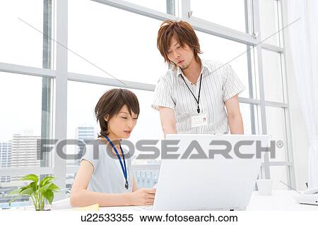 Young woman and man discussing View Large Photo Image Stock Photography - Young woman and man discussing. Fotosearch