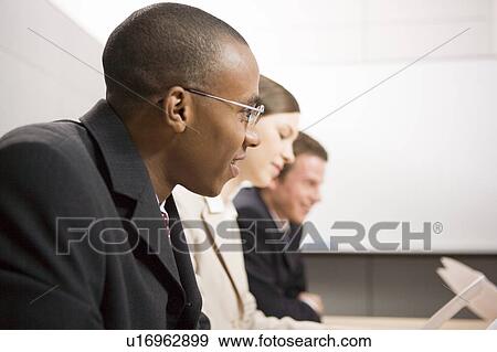 Business people having meeting View Large Photo Image Stock Photo - Business people having meeting. Fotosearch