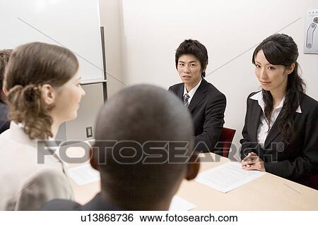 Business people having meeting View Large Photo Image Stock Photograph - Business people having meeting. Fotosearch