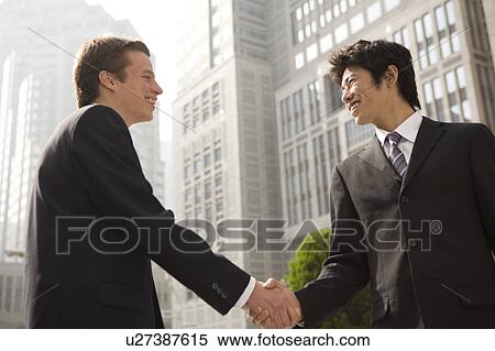 Stock Photography - Businessmen shaking hands. Fotosearch