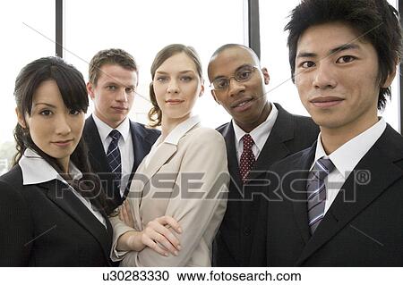 Group of business people looking at camera View Large Photo Image Stock Image - Group of business people looking at camera. Fotosearch