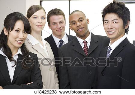 Stock Photo - Group of business people looking at camera. Fotosearch