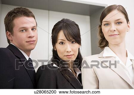 Stock Image - Three business people. Fotosearch