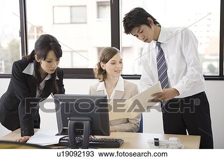 Three business people working in office View Large Photo Image Stock Image - Three business people working in office. Fotosearch