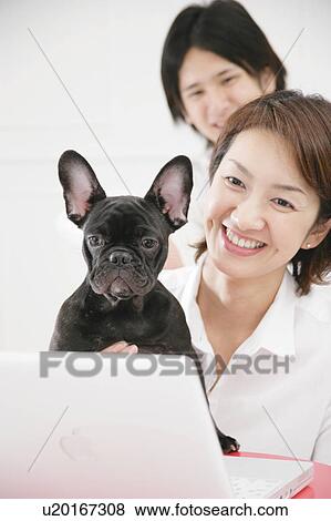 Stock Photo - Young couple and French Bulldog. Fotosearch