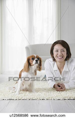 Young woman and cavalier king Charles spaniel View Large Photo Image Stock Photograph - Young woman and cavalier king Charles spaniel. Fotosearch