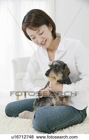 Stock Photo - Young woman and Dachshund. Fotosearch