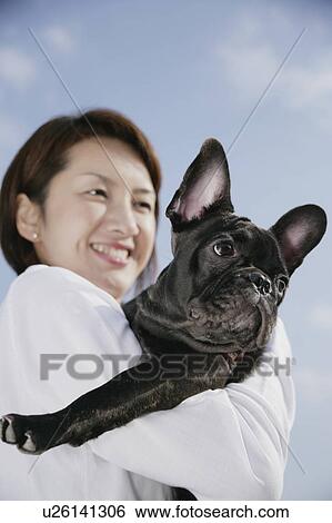 Stock Photograph - Young woman and French Bulldog. Fotosearch