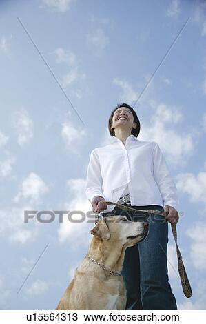 Young woman and Labrador retriever View Large Photo Image Stock Image - Young woman and Labrador retriever. Fotosearch