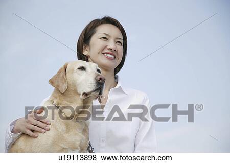Young woman and Labrador retriever View Large Photo Image Stock Photo - Young woman and Labrador retriever. Fotosearch