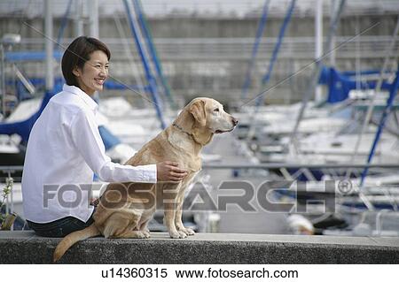 Young woman and Labrador retriever View Large Photo Image Stock Photography - Young woman and Labrador retriever. Fotosearch