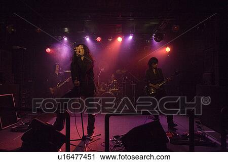 Stock Image - Rock band in concert. Fotosearch