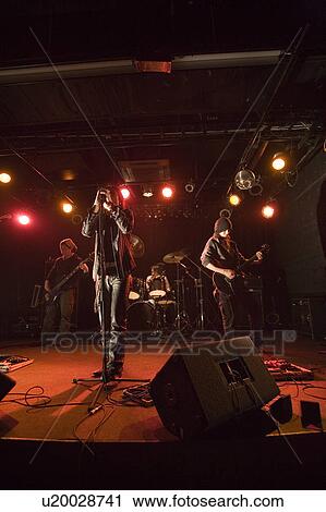 Rock band in concert View Large Photo Image Stock Image - Rock band in concert. Fotosearch