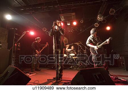 Rock band in concert View Large Photo Image Stock Photo - Rock band in concert. Fotosearch