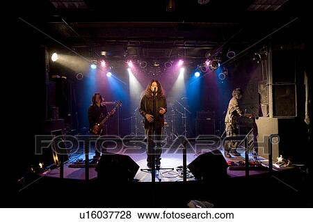 Rock band in concert View Large Photo Image Stock Photo - Rock band in concert. Fotosearch