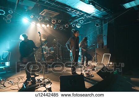 Rock band in concert View Large Photo Image Stock Photography - Rock band in concert. Fotosearch