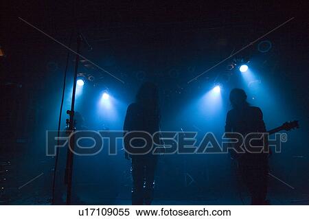 Stock Photography - Rock band in concert. Fotosearch