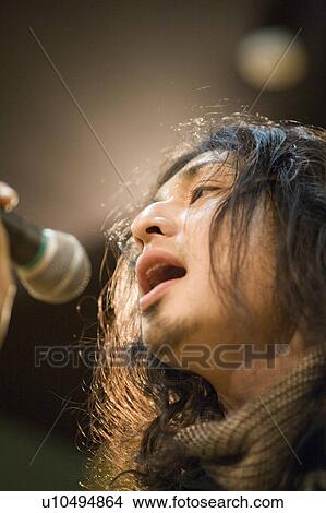 Young man singing View Large Photo Image Picture - Young man singing. Fotosearch