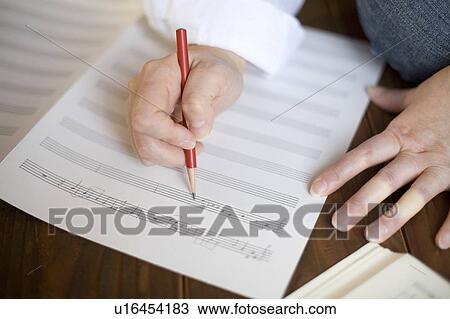 Young woman composing music View Large Photo Image Stock Image - Young woman composing music. Fotosearch