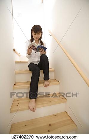 Young woman reading book View Large Photo Image Stock Image - Young woman reading book. Fotosearch
